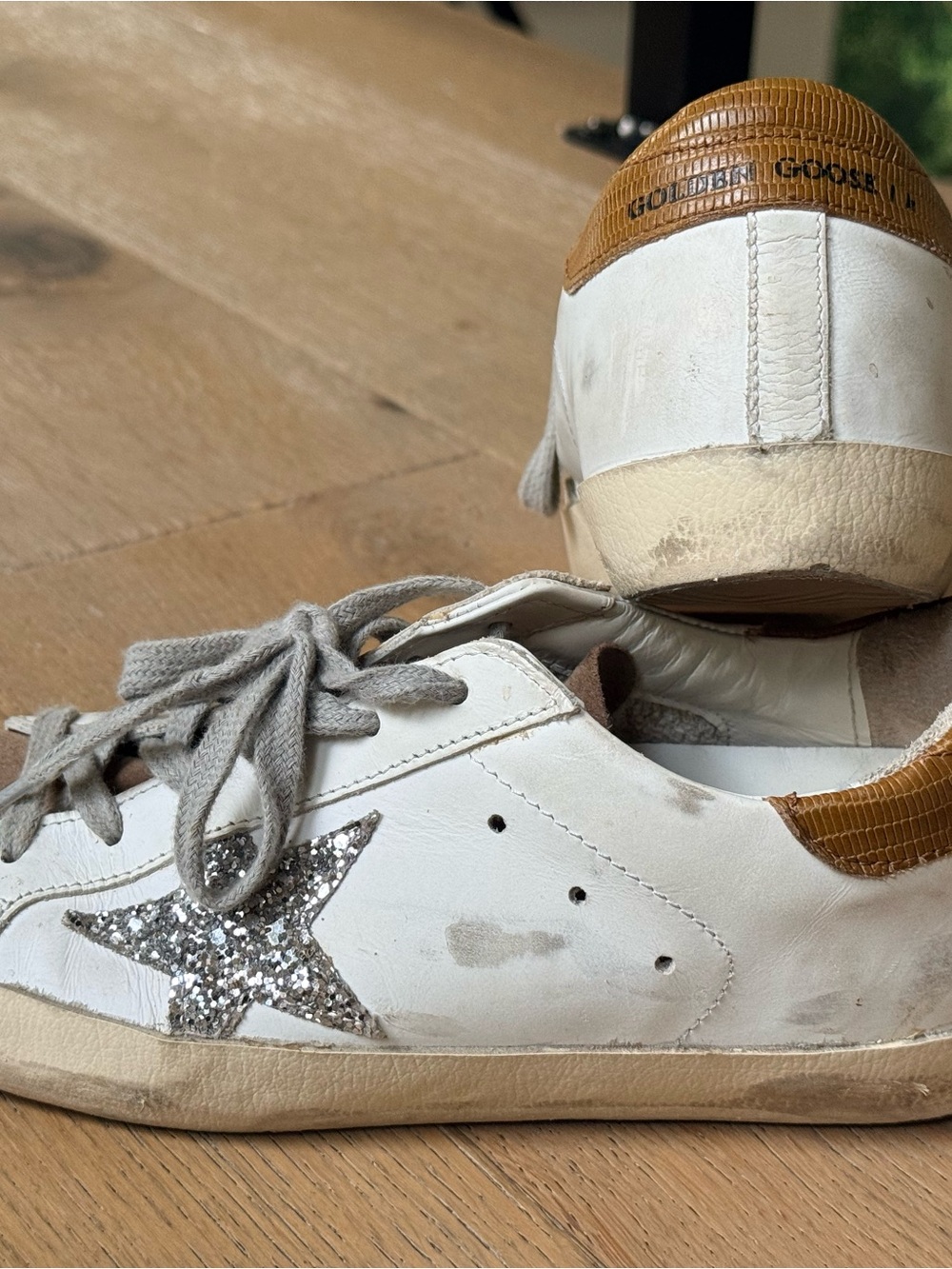 Golden Goose superstars with suede toe, silver glitter star and tan heel tab